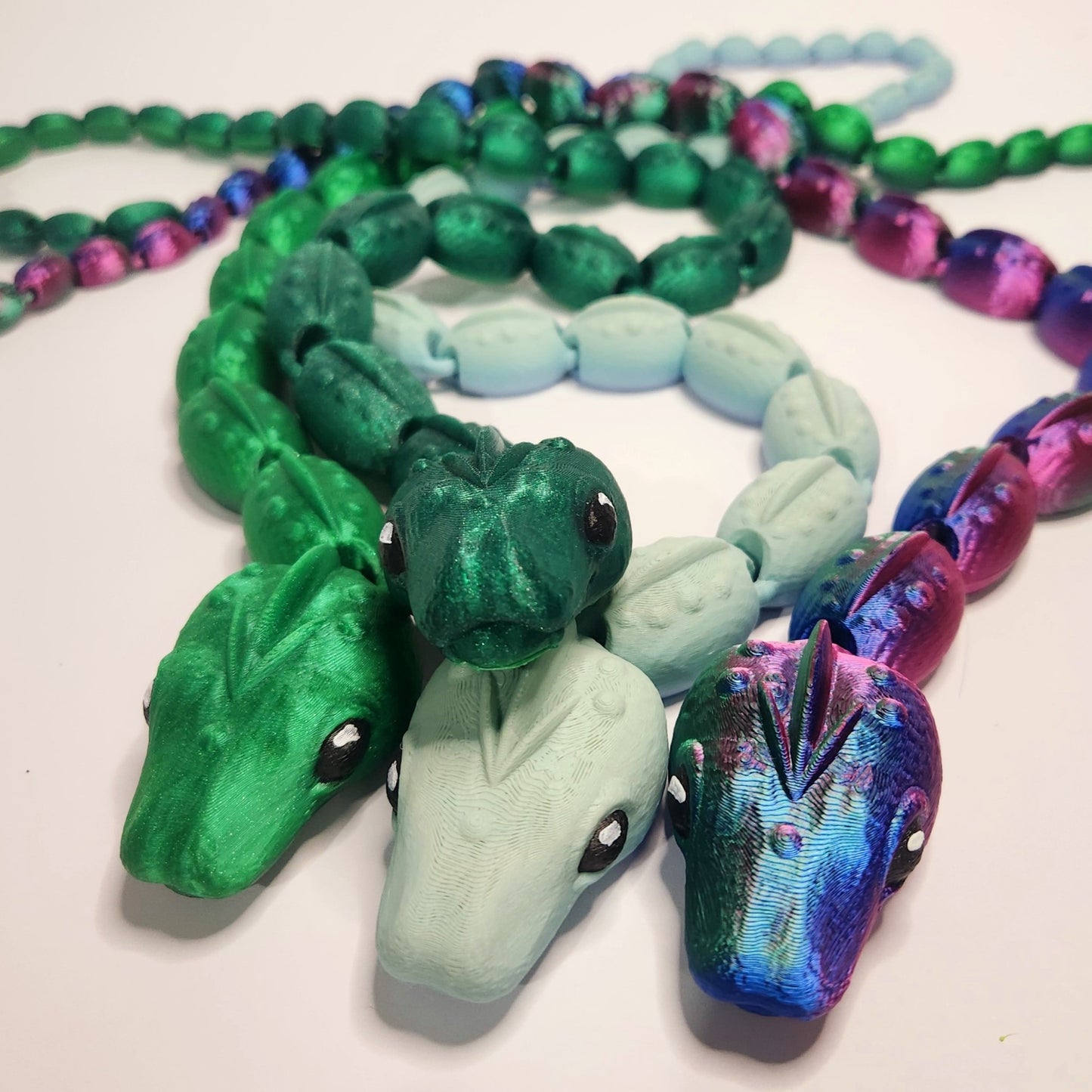 Group of small 2ft flexi snakes made by Hummingbird Trove