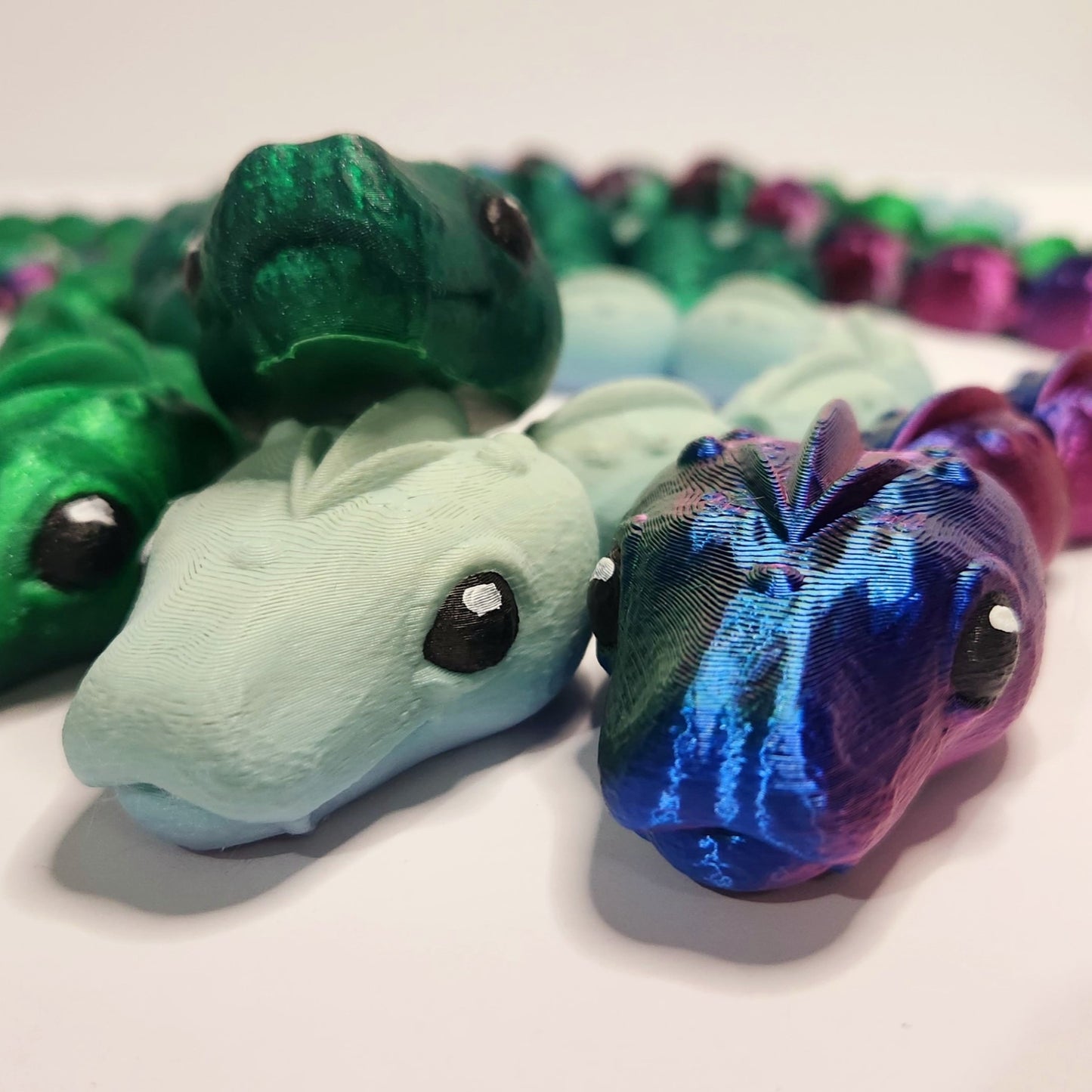 Faces of Flexi Snakes made by Hummingbird Trove